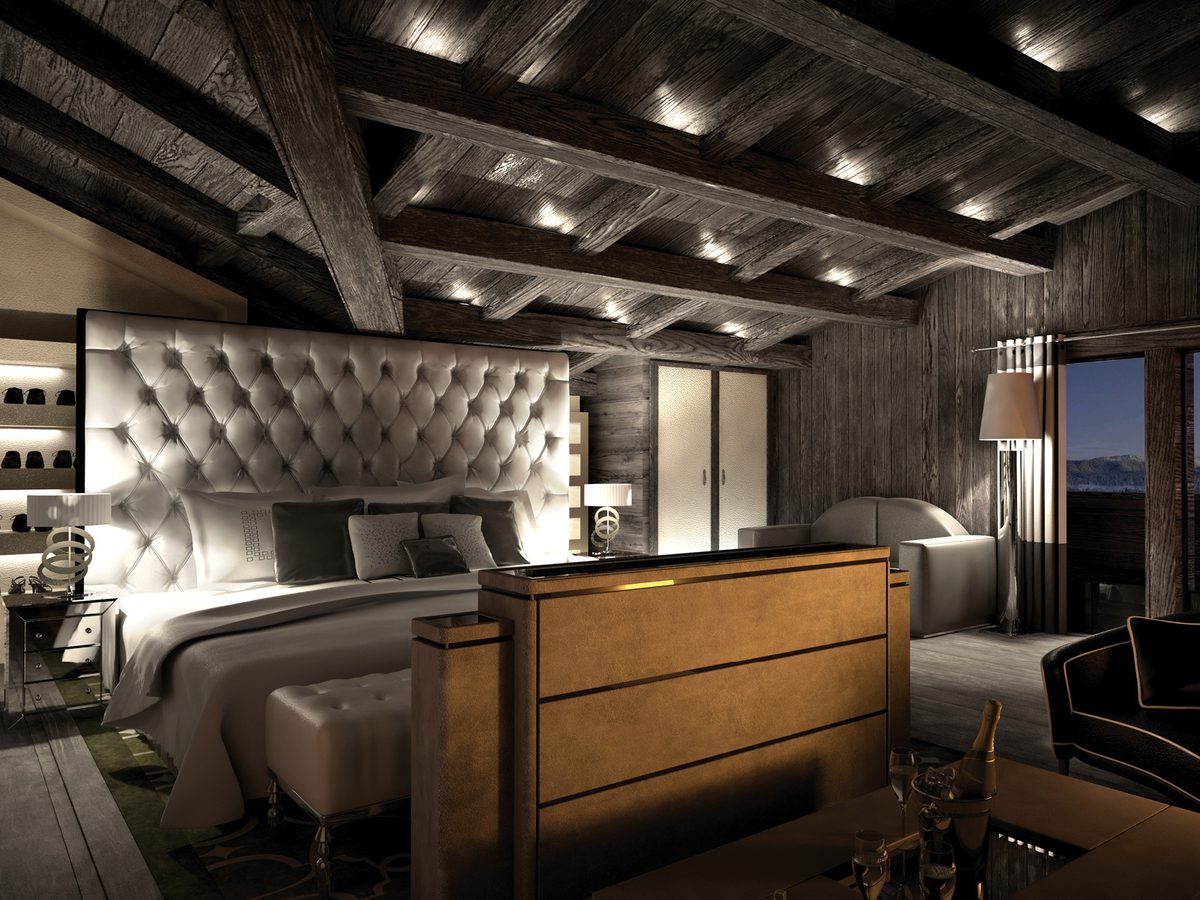 Perspective d'une suite de l'hôtel de Gstaad : charpente apparente, tête de lit capitonnée et vue sur les Alpes